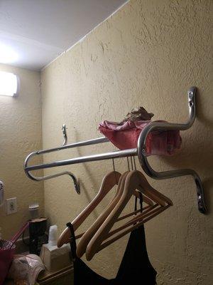 Clothes rack isn't even attached to the wall.