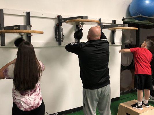 Family learning the speedbag