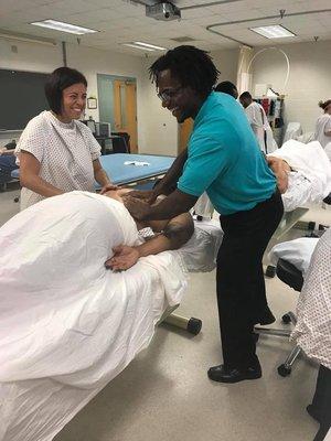 Showing physical therapist assistant students some massage moves