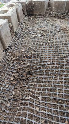 This wire mesh, originally laid down by Thunderbird, was previously flush with the bottom of those blocks.