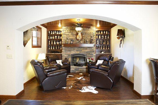 Rustic Basement Remodel: Fireplace room with arch entryway