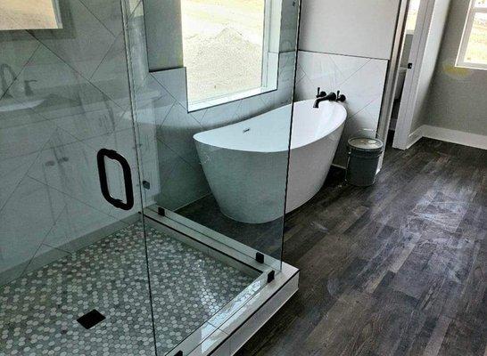 A complete shower and bathroom floor.