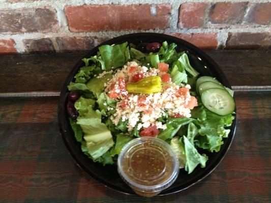 Come try out Greek Salad.  Fresh lettuce, diced tomatoes, sliced cucumbers, olives, peppers, feta cheese, and Bogie's Dressing