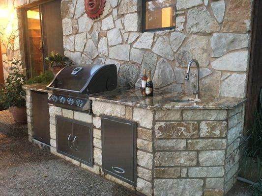 BBQ enclosure with interesting angles on the sides.