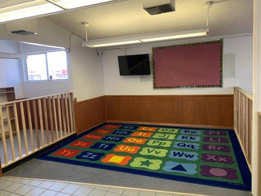 This is where kids sit and can play with toys, read, change spots of the school maybe nap very roomy and comfortable