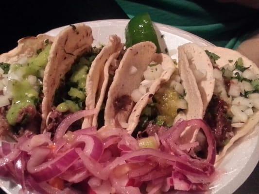 Lengua and cabeza tacos, pickled onion