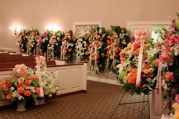 Over 20 floral sprays created by Wendy began to fill the chapel.