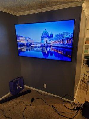 75" full motion mount, outlet relocated behind tv