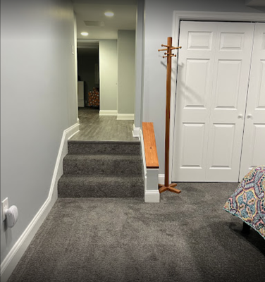 Basement remodel: new carpet, vinyl flooring, drywall, fresh paint, stabilized ceiling joists.