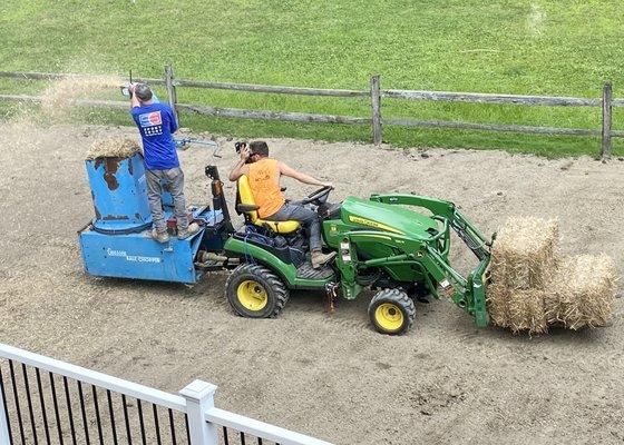 After topsoil and grass seed, blowing hay