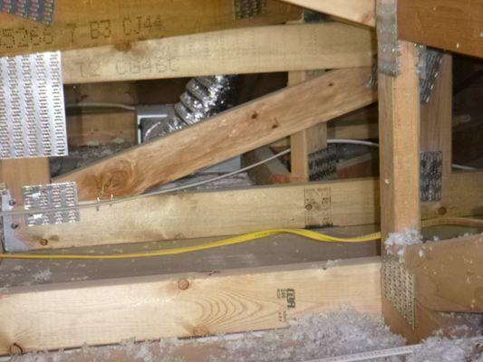 The attic above the bathroom is entirely devoid of insulation in a brand-new home. The insulation subcontractor will return to fix it.