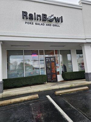 Closer look at the sign and entrance to the RainBowl restaurant.