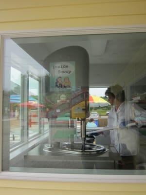 Kind lady making gelato in the production area :)