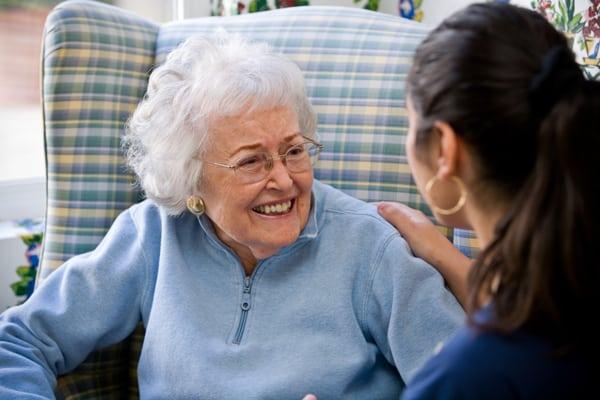 Resident enjoying a moment with staff