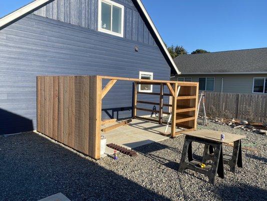 Building a windbreak and privacy enclosure for our hot tub with wood purchased at Oregon Overseas Timber Company.