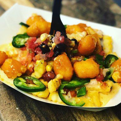 Loaded cheese fries with buffalo hushpuppies