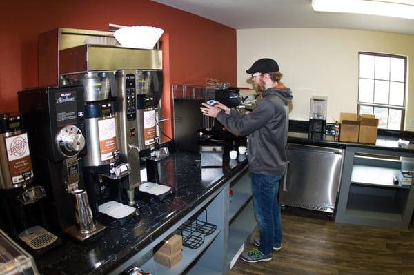 Ben is dialing in the machines for the best tasting coffee for our opening June 1.