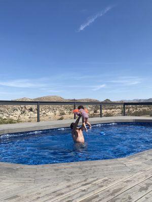 Pool, deck, mountains, guests.