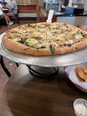 Weekly special - spinach, artichoke, and bacon pizza