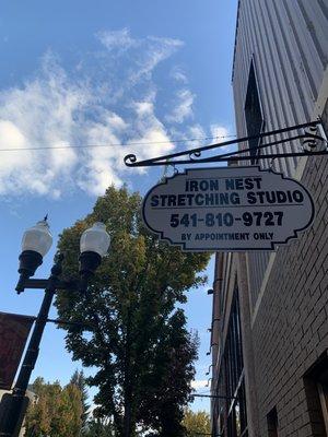 220 Main Street business sign. Upstairs window is my studio just above the sign.