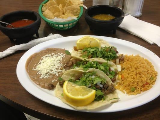 "Plato Mixto" 3 Tacos rice and beans. Delicious!