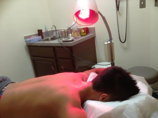 My son getting treatment for neck pain