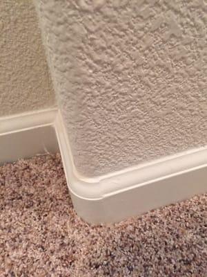 This is how the baseboards look though out the home notice no be gaps!