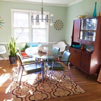 Mid Century Modern MCM Dining Area Featuring Eames Chairs, Nelson Clocks, and  Italian Chrome Lighting/Chandelier by Sciolari.