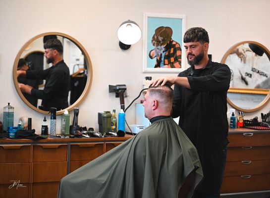 Seven, a great team member adding the final touches to his clients haircut.