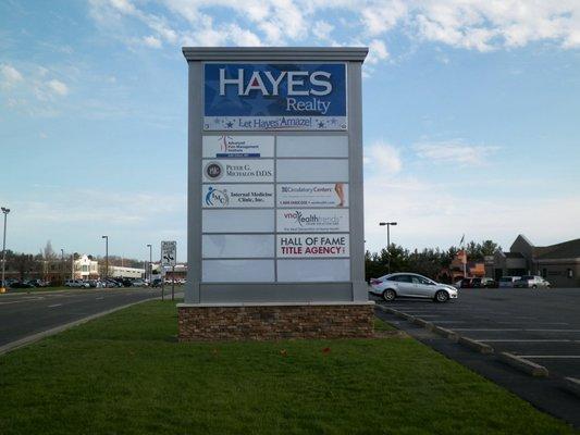 Brand new Plaza sign for Hayes Realty and plaza tenants