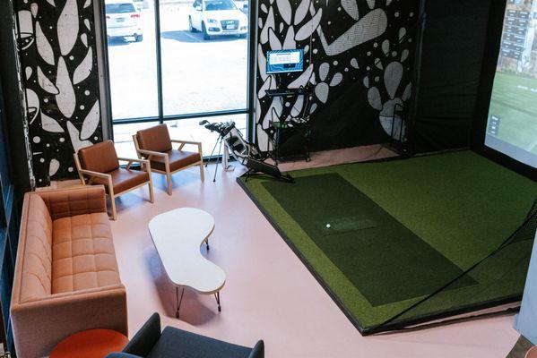 Indoor golf simulator bay