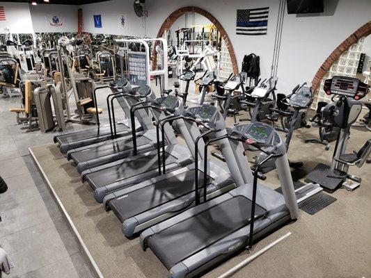 View of cardio machines: bikes and treadmills