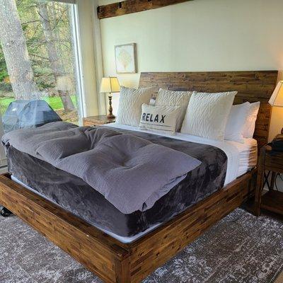 Our SUPER comfy bed with a heavenly comforter/duvet inside the Woodshed