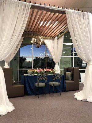 Pergola, chandeliers, Linens, tabletop, chairs, lounge seating