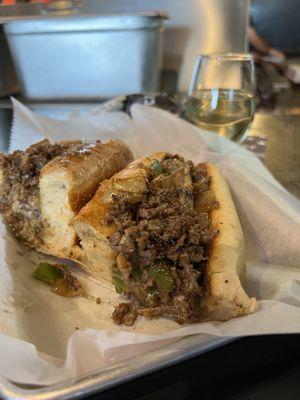 An excellent Cheesesteak w/ peppers, mushrooms, onion and provolone cheese