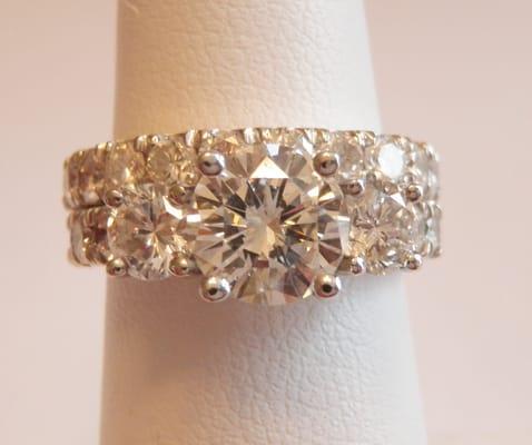 This is the new ring custom made to accomodate engagement ring, diamonds from wedding band and earrings