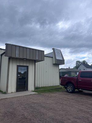 Non-descript building (parking on street & side of building)