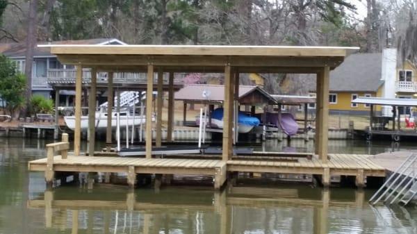 Boathouse with flat metal roof. With Standard 6x6 square pilings.