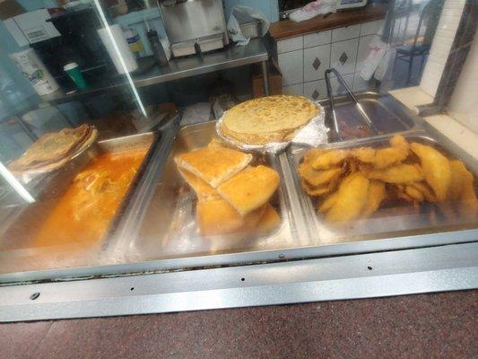 Flat bread, fried fish and fish soup/stew.