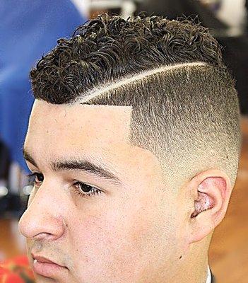 Skin-fade with engraved part curly hair