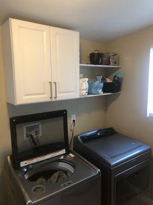 Custom storage shelves in a laundry room