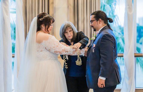 Donna performing the handfasting ceremony.