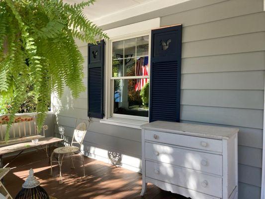 Squirrel cutouts on combo shutters with copper capping