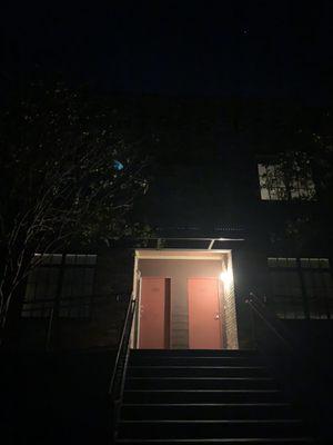 Front of the building with all exterior lights off. When the front unit doesn't have their porch light on, it's pitch black