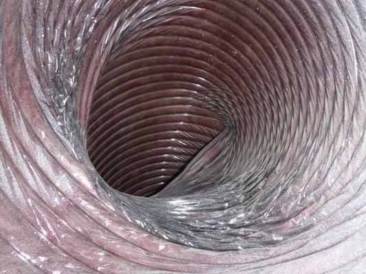 Duct interior. When ducts are not supported by strapping in the attic, they can lie against the truss, kinking them and reducing airflow.