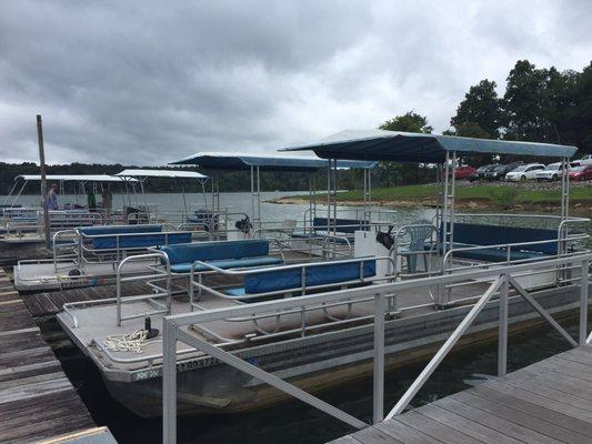 The pontoons available to rent... note the condition and the lawn chair used as the driver's seat.