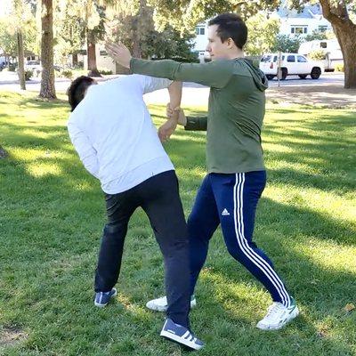 Practicing Wing Chun Kung Fu training exercise called Chi Sau (Sticking Hands)