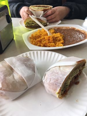 Tortas with a side of rice and beans.