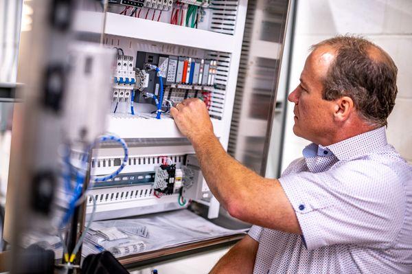 Cybertrol Engineering President Inspecting and Testing Control Panels