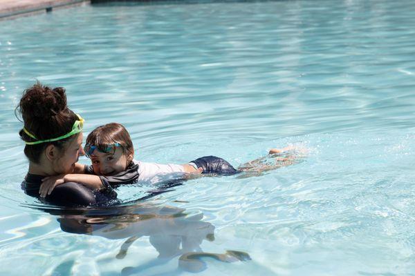 Boy first swim lesson